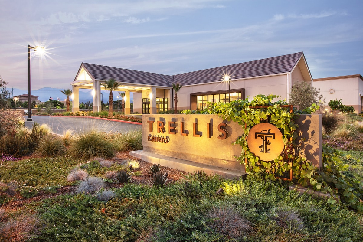 Front of Trellis Chino building with a wall with Trellis Chino's name and logo